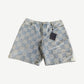 Louis Vuitton light wash denim shorts with embossed 3D Damier checkerboard pattern, front view
