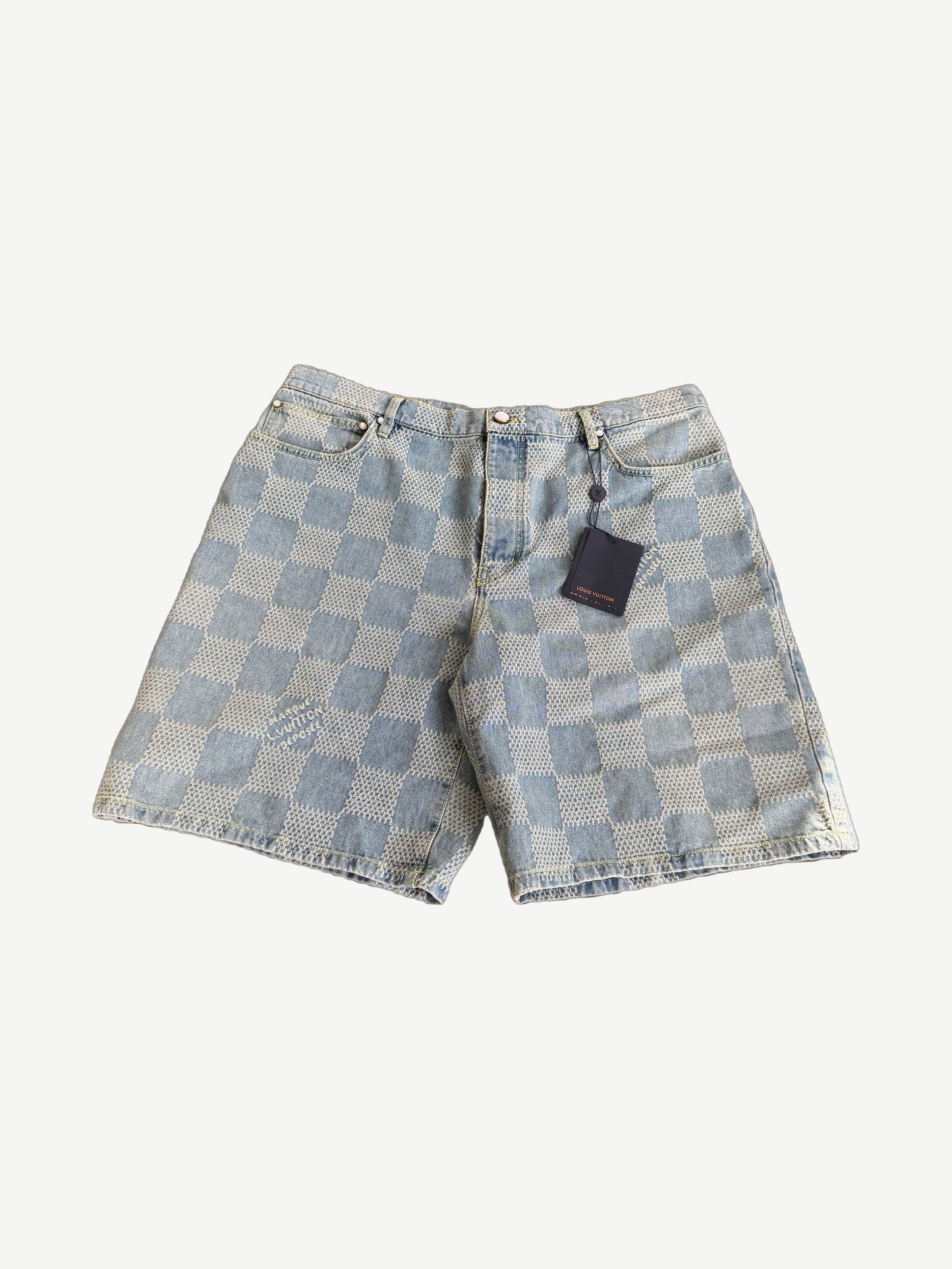 Louis Vuitton light wash denim shorts with embossed 3D Damier checkerboard pattern, front view