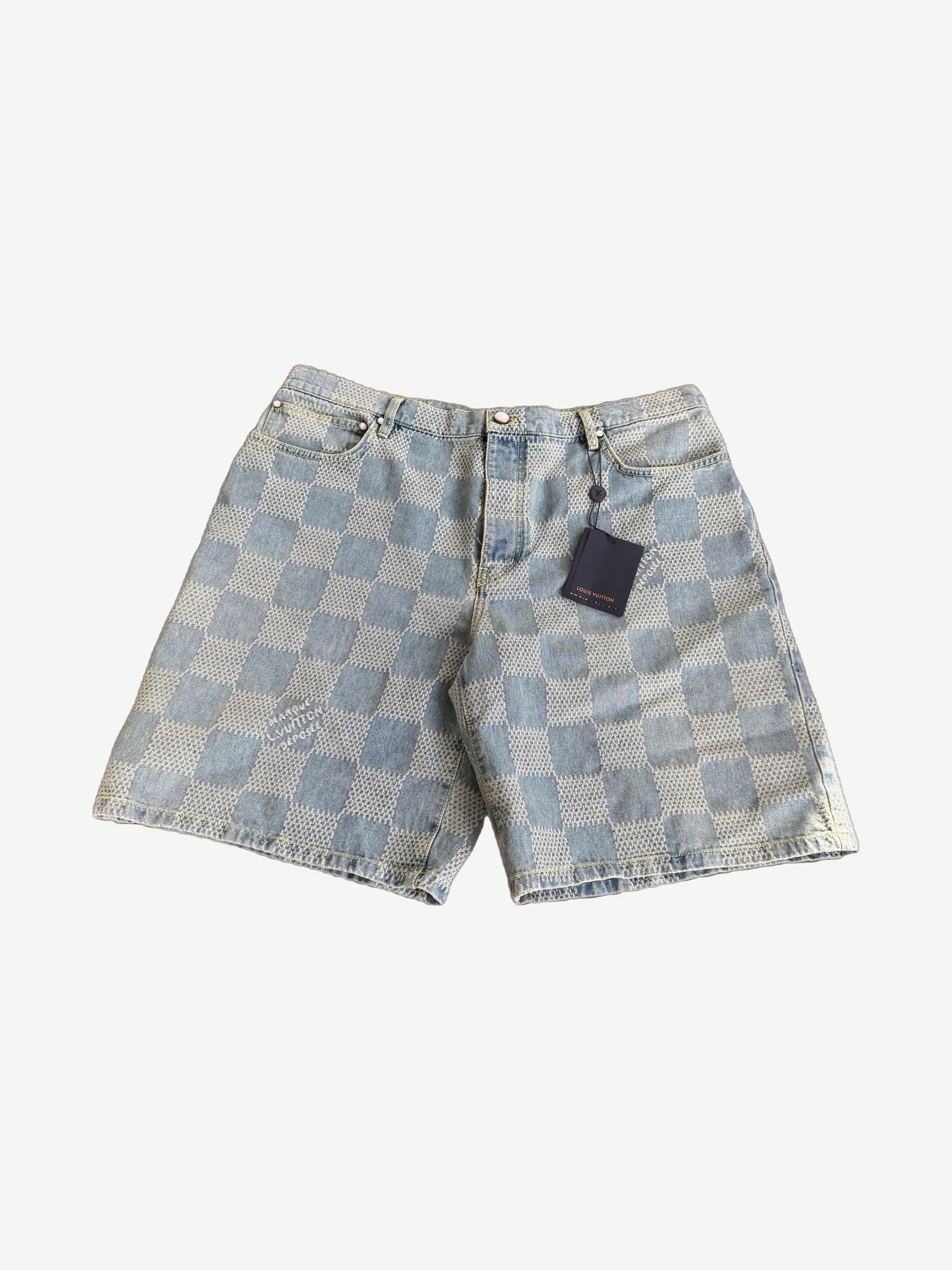Louis Vuitton light wash denim shorts with embossed 3D Damier checkerboard pattern, front view