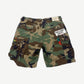 Gallery Dept camouflage cargo shorts, back view showing flap pockets on faded military print