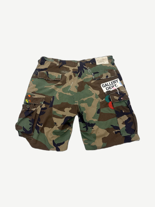 Gallery Dept camouflage cargo shorts, back view showing flap pockets on faded military print