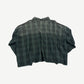Back view of Raspberry Hills green plaid cropped flannel showing dark check pattern and boxy silhouette.