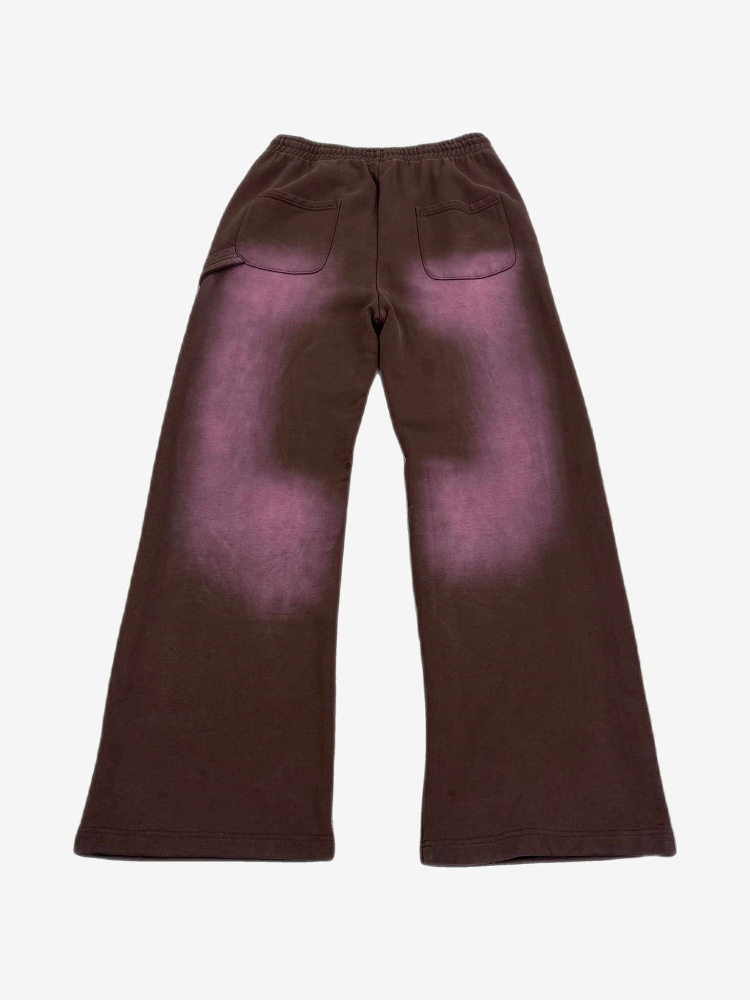 Back of HMDD brown sweatpants showing faded purple sun-bleached fade across seat and rear pockets.