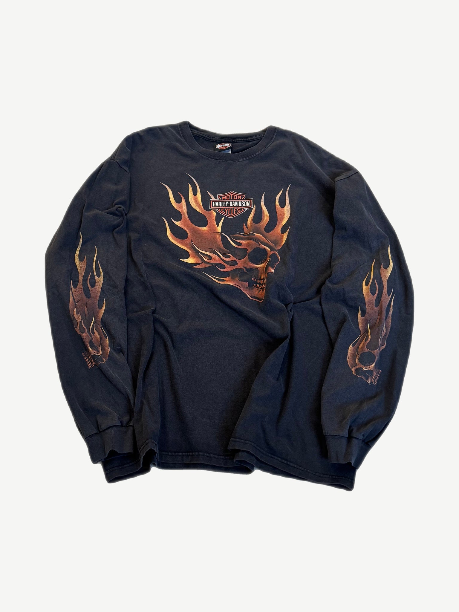 Vintage Harley Davidson black long sleeve tee with skull and flame OKC dealer print across the chest.