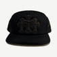 Chrome Hearts black trucker hat front with three stitched leather cross patches on twill crown and mesh sides