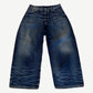 Acne Studios mid blue 2023M baggy fit jeans with heavy whisker fading at knees and contrast stitching.