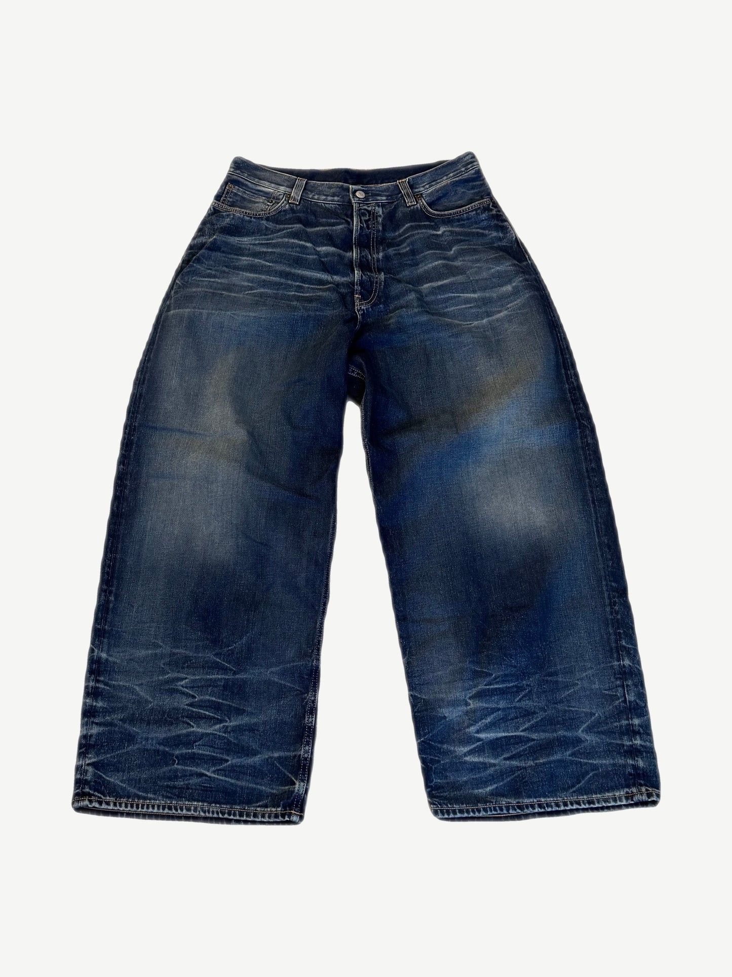 Acne Studios mid blue 2023M baggy fit jeans with heavy whisker fading at knees and contrast stitching.