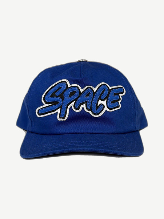 Chrome Hearts Matty Boy royal blue 5-panel hat front, white SPACE graffiti leather patch and short curved brim.