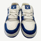 Louis Vuitton blue Trainer sneakers top-down view showing LV tongue tags and white monogram embossed leather
