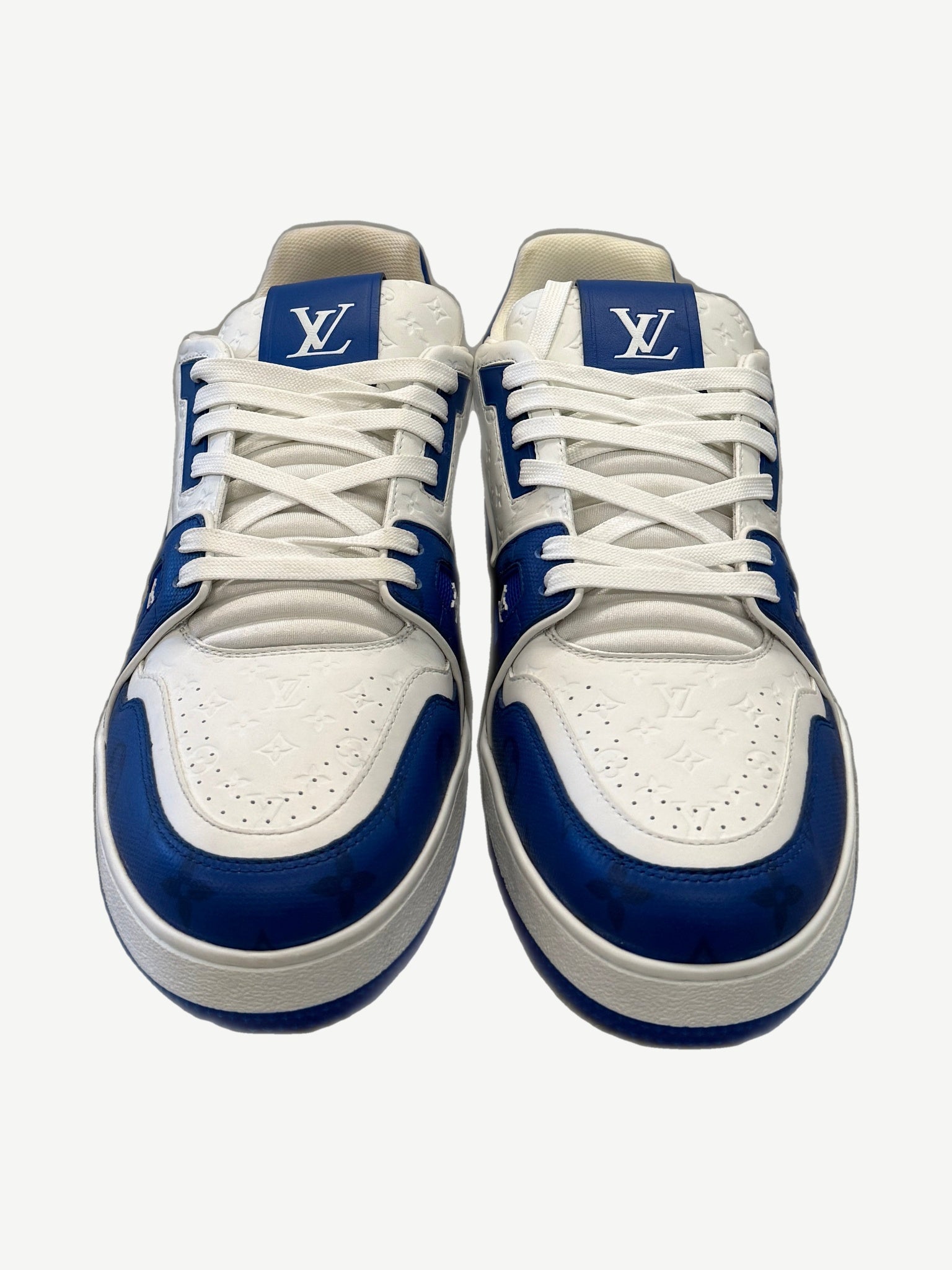 Louis Vuitton blue Trainer sneakers top-down view showing LV tongue tags and white monogram embossed leather