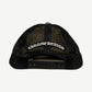 Chrome Hearts black mesh trucker hat back with embroidered Chrome Hearts Old English arch and snapback closure.
