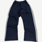 Balenciaga navy striped sweatpants rear view with wide leg fit and contrasting triple stripe side panels