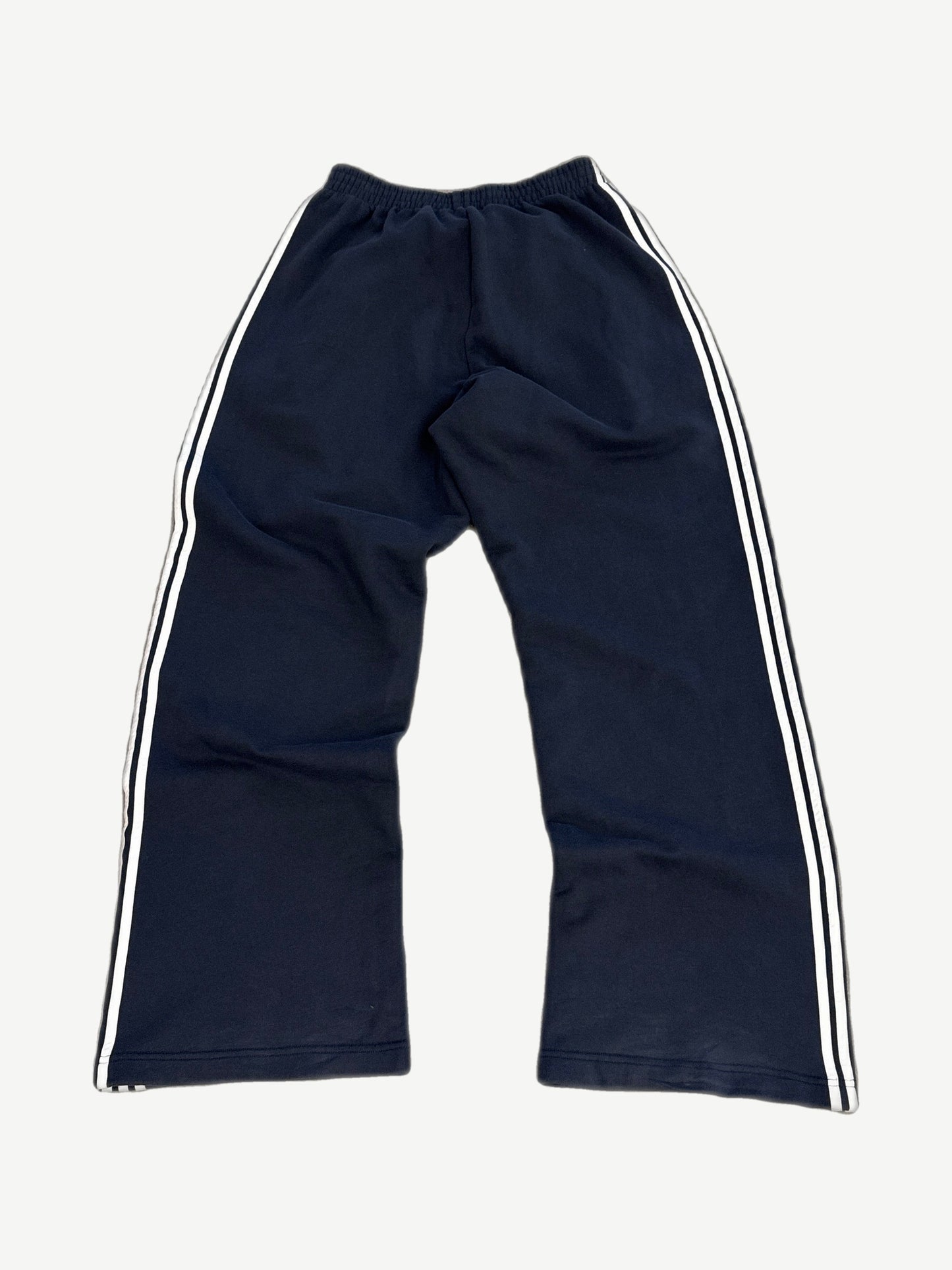 Balenciaga navy striped sweatpants rear view with wide leg fit and contrasting triple stripe side panels