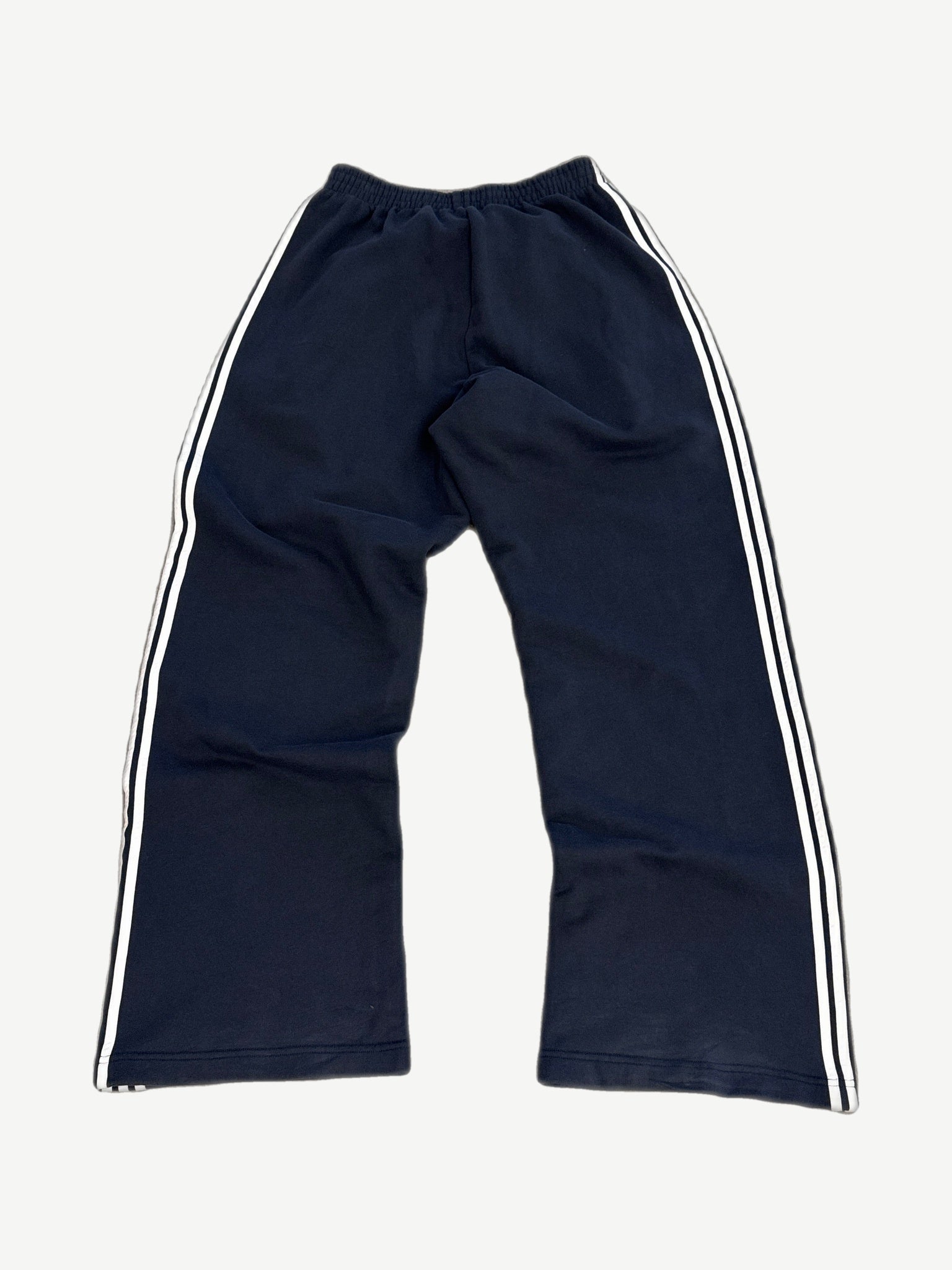Balenciaga navy striped sweatpants rear view with wide leg fit and contrasting triple stripe side panels