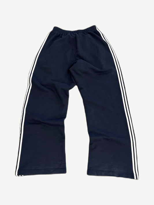Balenciaga navy striped sweatpants rear view with wide leg fit and contrasting triple stripe side panels