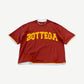 Bottega Desires red oversized tee with yellow varsity arch BOTTEGA chest print and layered hem