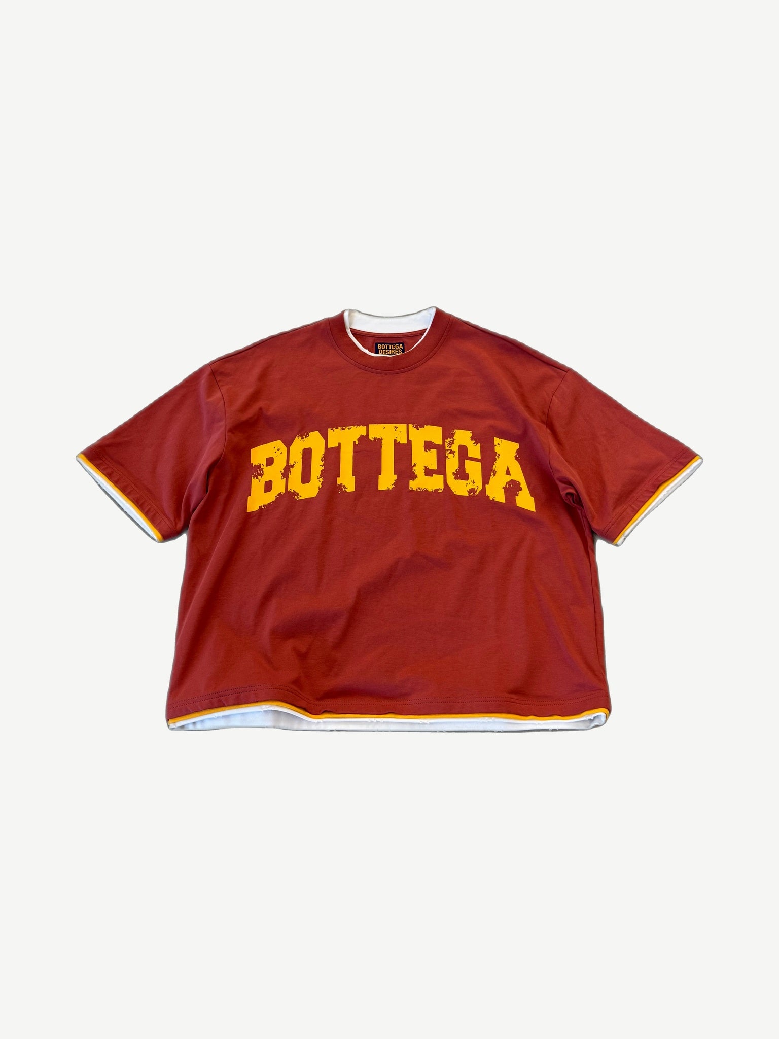 Bottega Desires red oversized tee with yellow varsity arch BOTTEGA chest print and layered hem