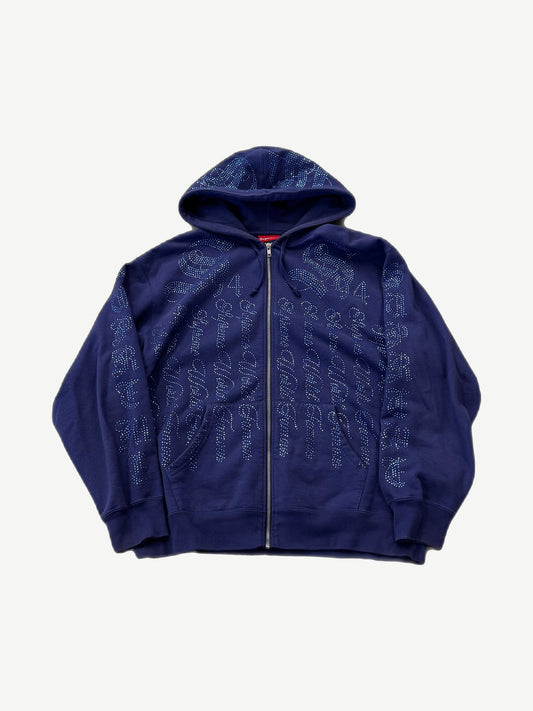 Supreme washed navy full-zip hoodie front with all-over rhinestone Supreme script logo print and box logo tab