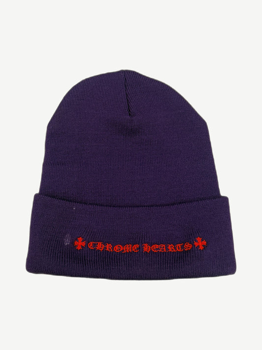 Back of Chrome Hearts purple beanie showing red Old English Chrome Hearts script embroidery on cuff