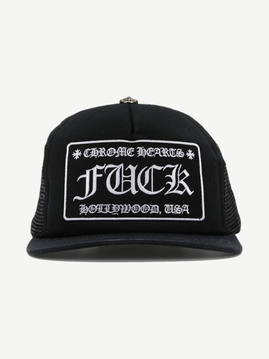 Chrome Hearts black trucker hat with Fuck Hollywood USA embroidered patch and silver cross button on crown