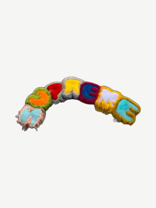 Supreme faux fur pillow in vibrant multicolor shag with bold rainbow stripes and signature box logo accent