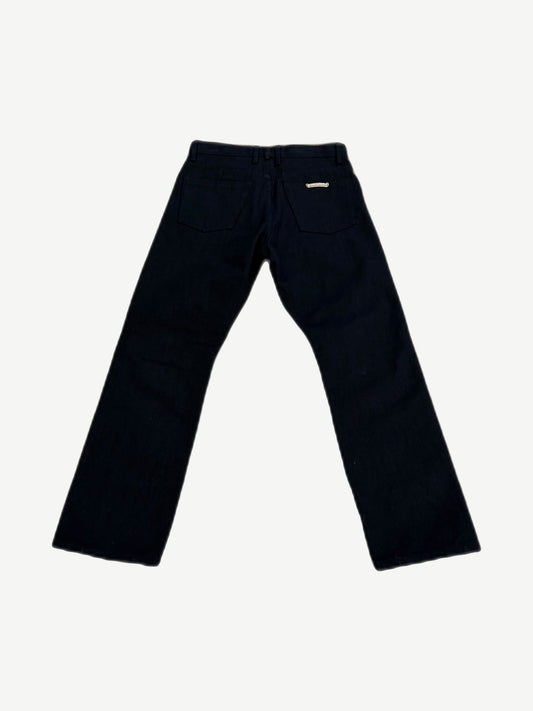 Chrome Hearts black Fleur jeans back view with five-pocket cut and embossed leather waistband tag