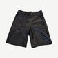 HMDD black lamb leather shorts front, knee-length jort cut with five-pocket styling and zip fly closure.