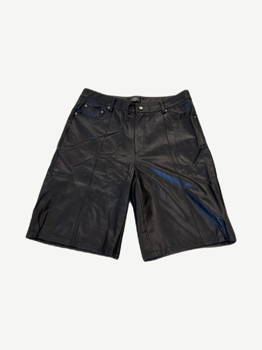 HMDD black lamb leather shorts front, knee-length jort cut with five-pocket styling and zip fly closure.