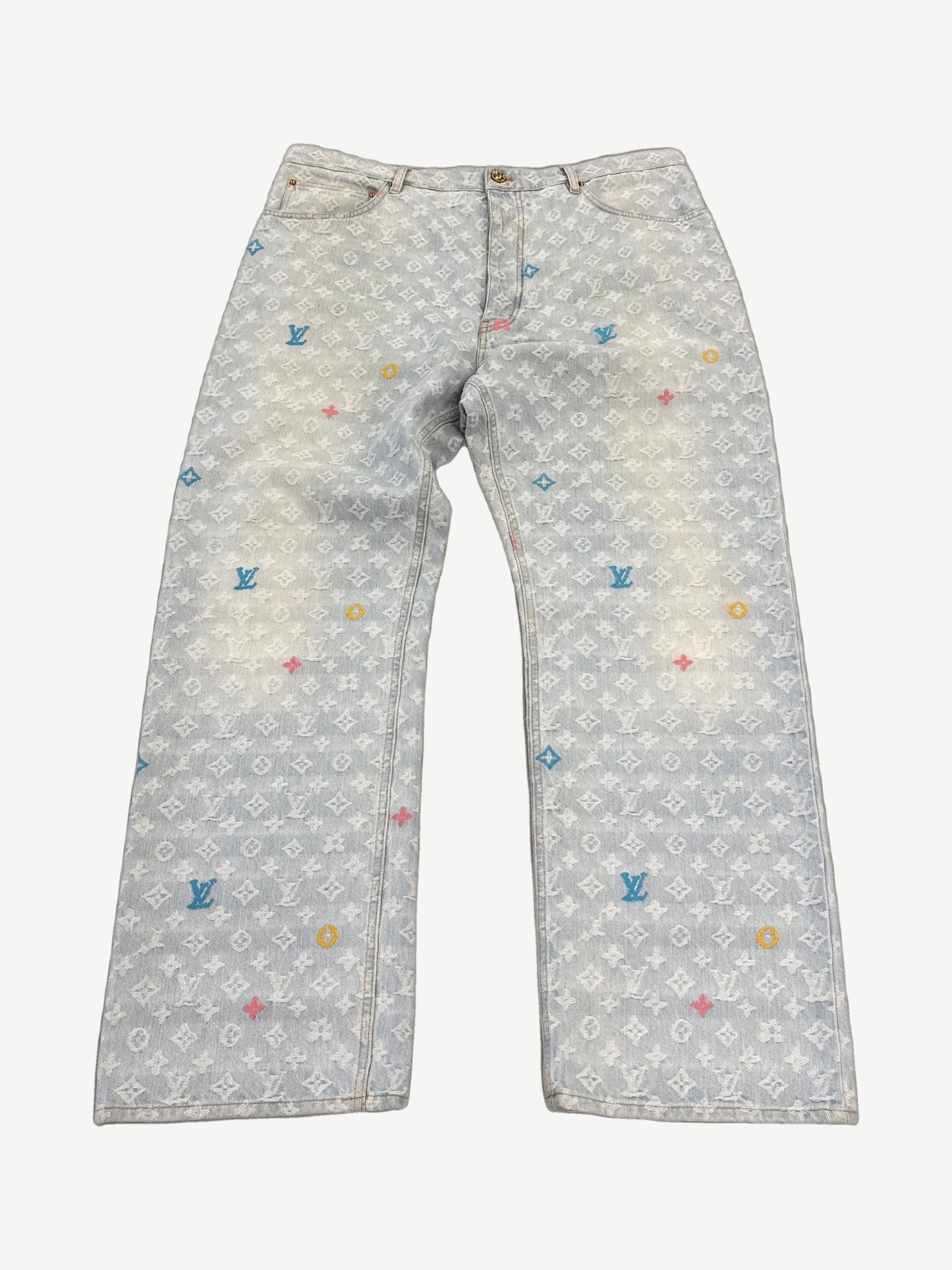 Louis Vuitton x Tyler the Creator denim jeans, mid-wash blue with tonal LV monogram jacquard pattern, straight leg.