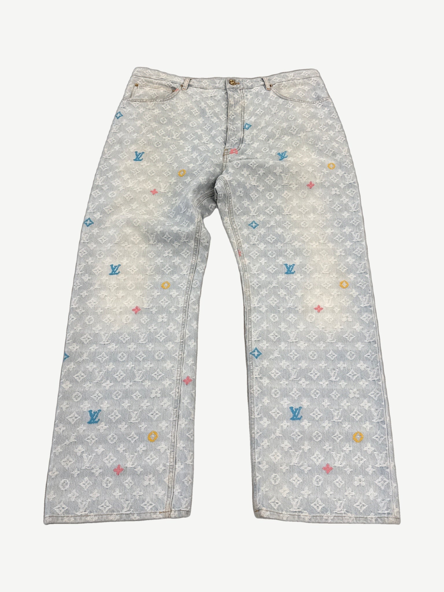Louis Vuitton x Tyler the Creator denim jeans, mid-wash blue with tonal LV monogram jacquard pattern, straight leg.