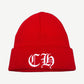 Chrome Hearts red ribbed knit cuffed beanie with white Old English CH embroidered logo on cuff.