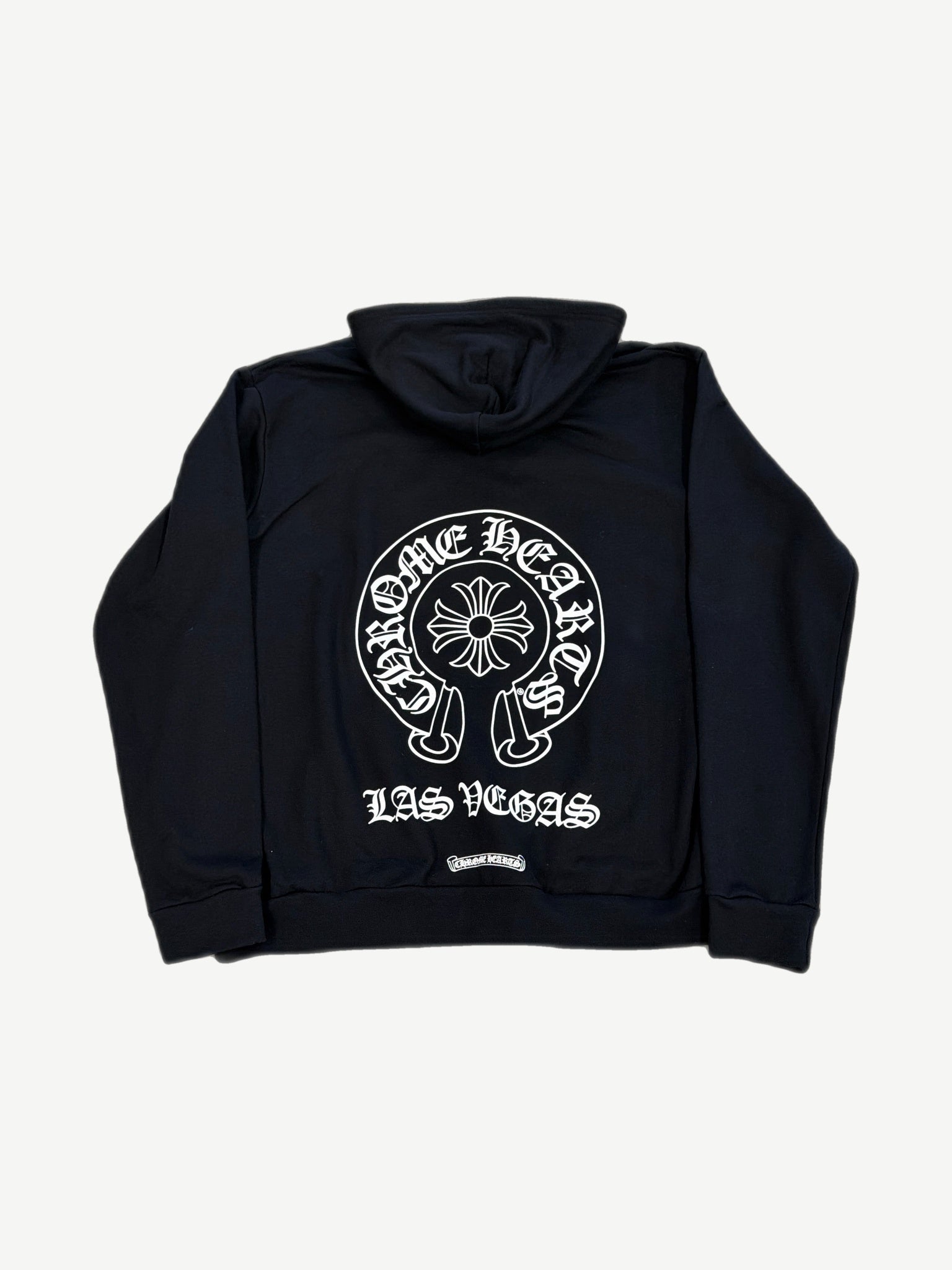 Chrome Hearts black zip hoodie back with large white Las Vegas horseshoe cross graphic across shoulders