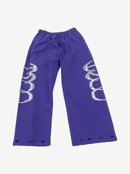 HMDD Happy Memories Don't Die purple sweatpants with silver foil radar graphics on both legs and distressed hems