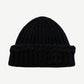 Black Chanel cashmere ribbed beanie with tonal embossed interlocking CC logo and sequin shimmer detail.