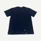 Dior x Cactus Jack navy oversized tee back view with white paint splatter detailing on lower hem