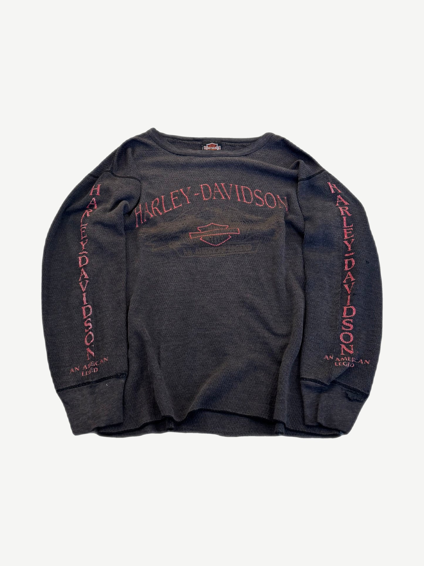 Vintage Harley Davidson black thermal waffle longsleeve front with American Legend chest print logo.