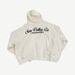 Raspberry Hills cream zipup back with large Sun Valley CA cursive script print across shoulders