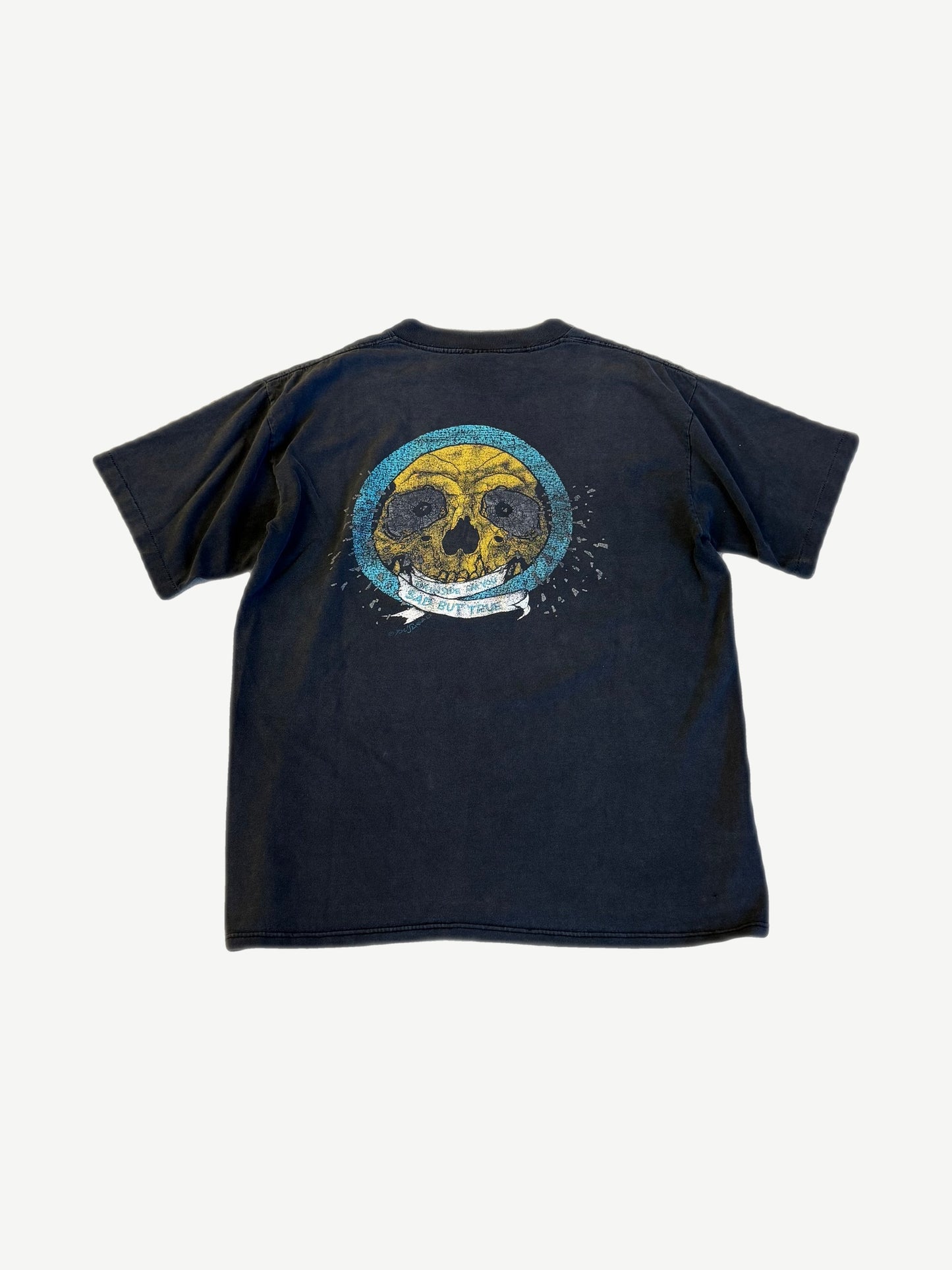 Vintage Metallica faded black tee back with Pushead yellow skull on teal circle and Sad But True ribbon banner.