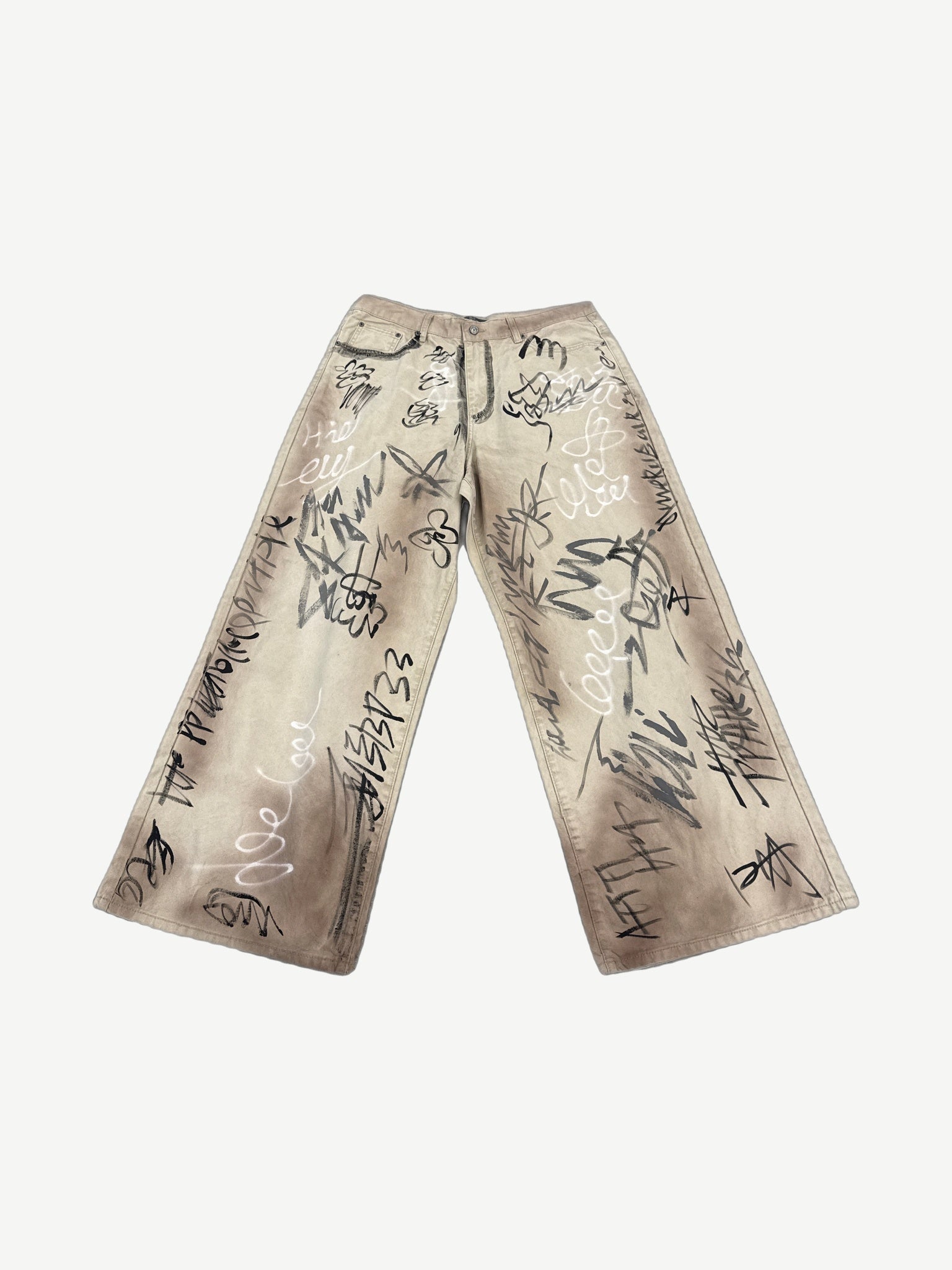 HMDD tan wide-leg chino pants with all-over black and white graffiti scribble print