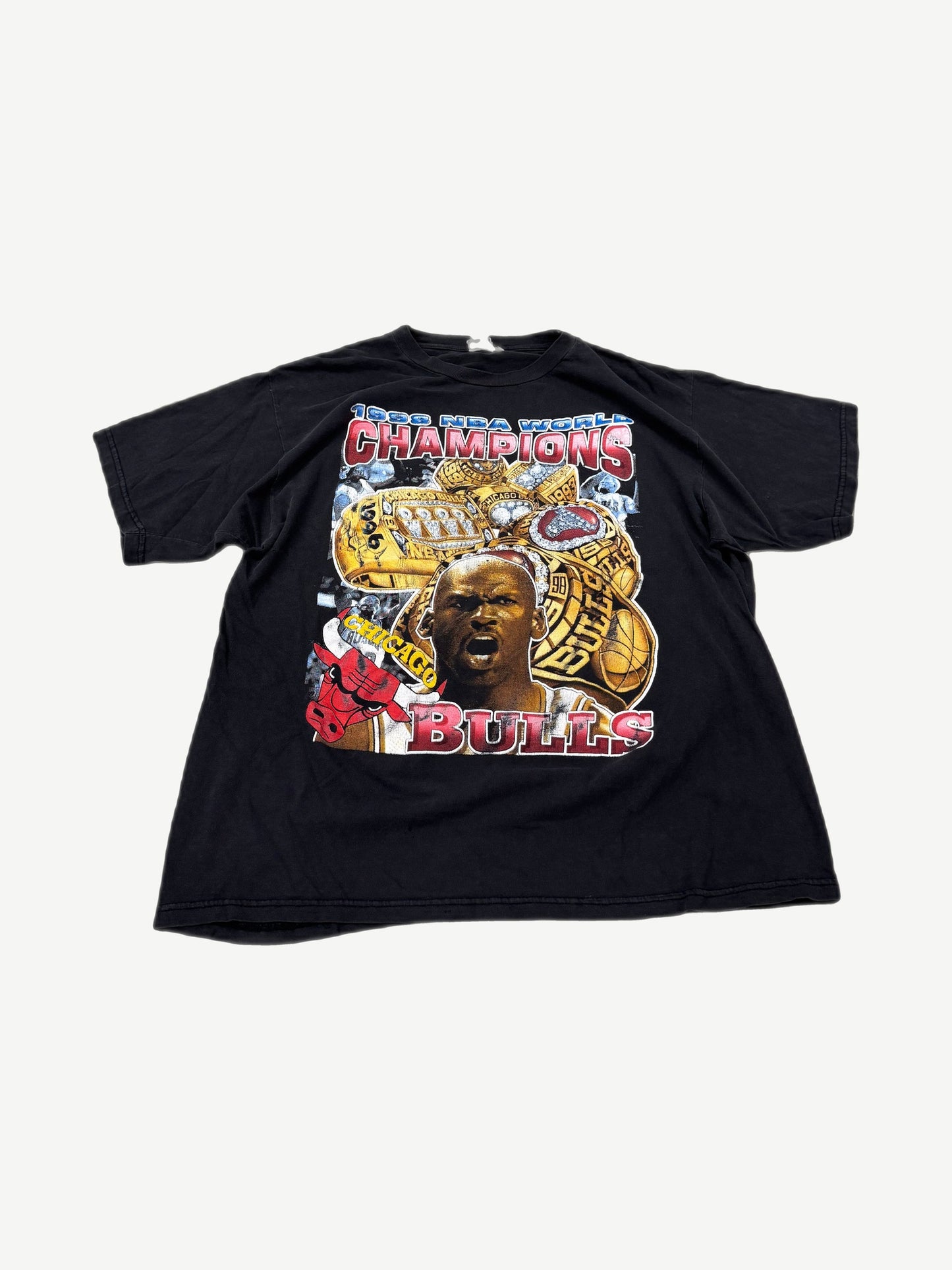 Vintage Chicago Bulls 1998 World Champs rap tee in black with photo graphic and championship lettering.