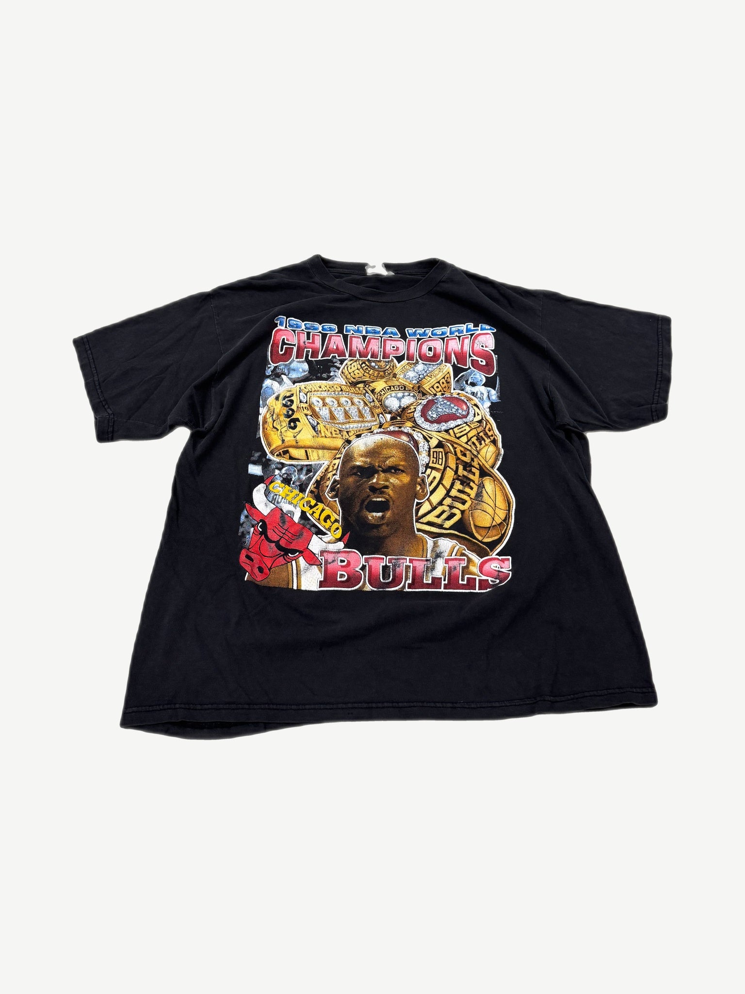 Vintage Chicago Bulls 1998 World Champs rap tee in black with photo graphic and championship lettering.