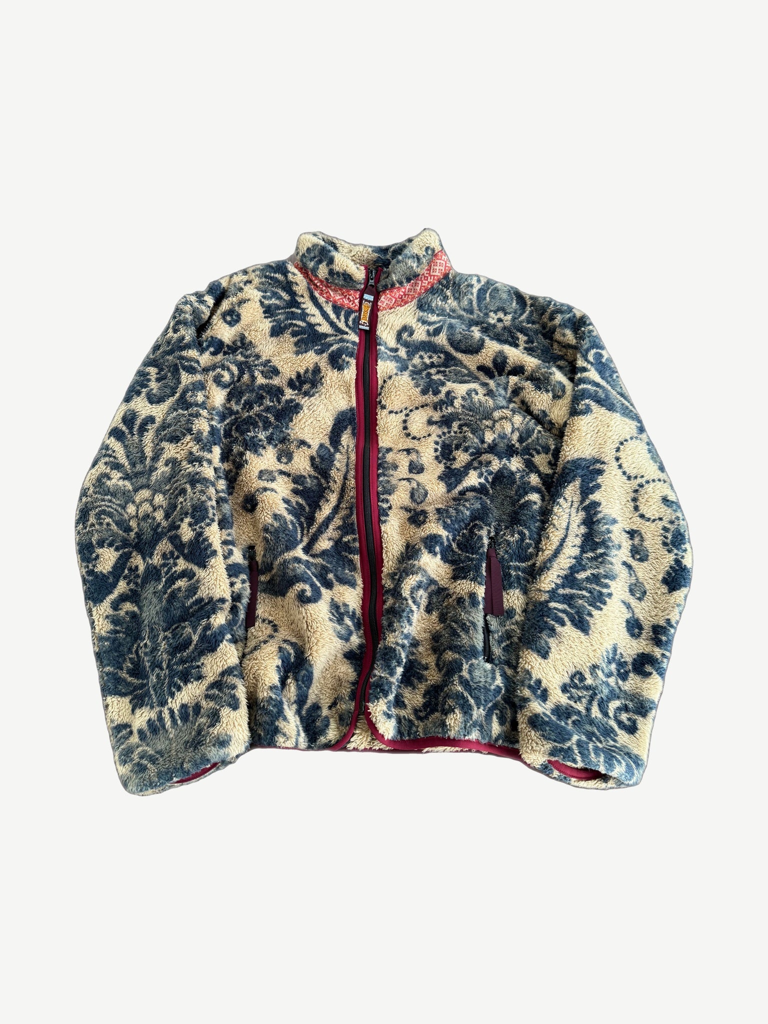 Kapital damask blue and cream printed fleece zip jacket with red trim and bandana style baroque pattern.