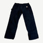 Vintage Carhartt black double knee carpenter pants back with orange Carhartt label on rear pocket and hammer loop