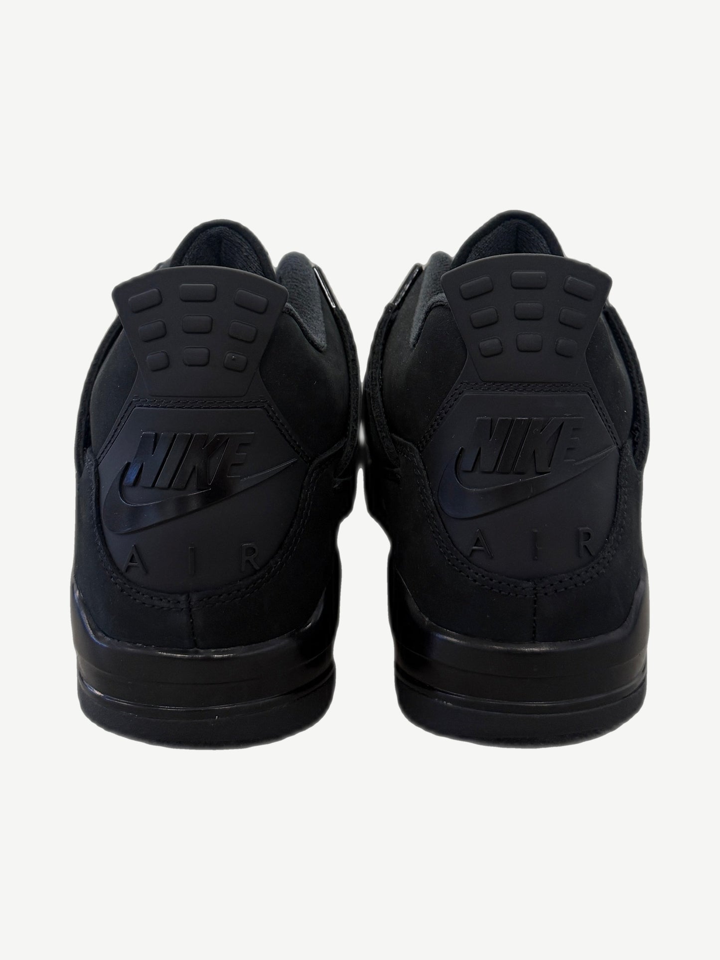 Heel detail of Air Jordan 4 Black Cat 2025 showing tonal Nike Air logo and matte black nubuck heel counter
