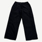 Supreme Umbro black ripstop track pants back view, clean black panels with right rear zip pocket detail.