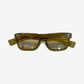 Chrome Hearts yellow glasses side view showing engraved temples with sterling silver dagger logo accents