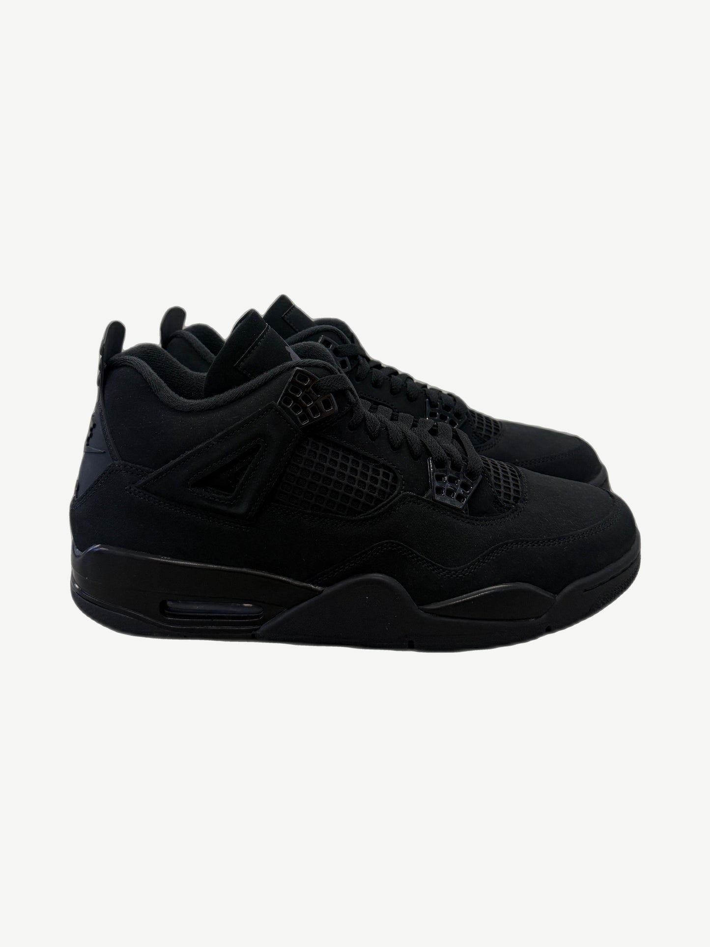 Air Jordan 4 Black Cat 2025 sneakers in tonal black nubuck with mesh side panels and tonal eyelets, side profile