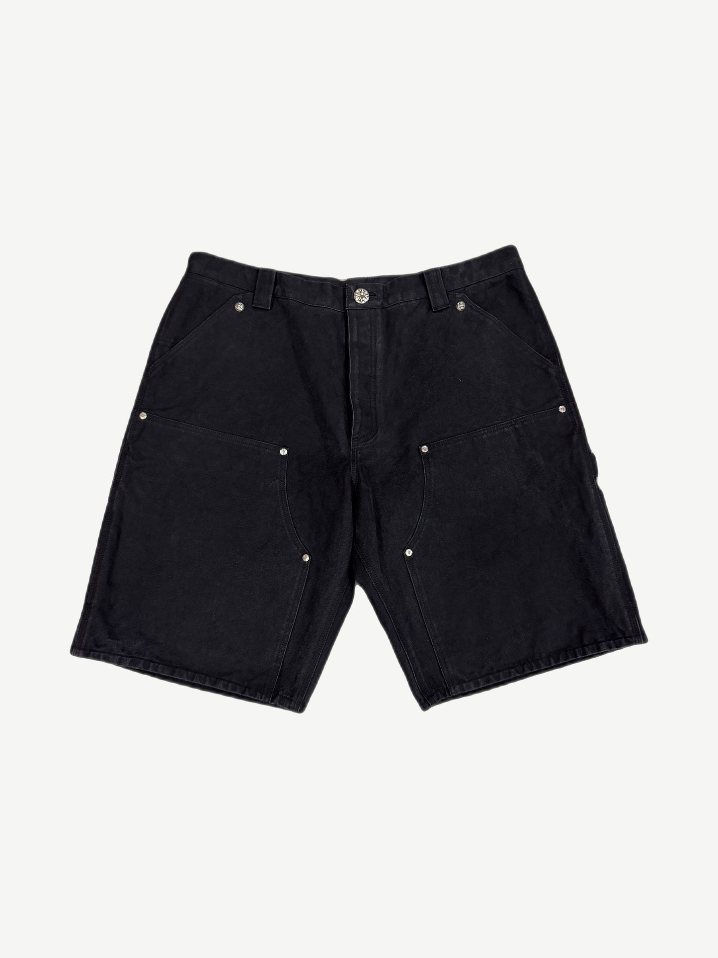 Chrome Hearts black canvas carpenter shorts front view with silver cross button hardware and double-knee panels