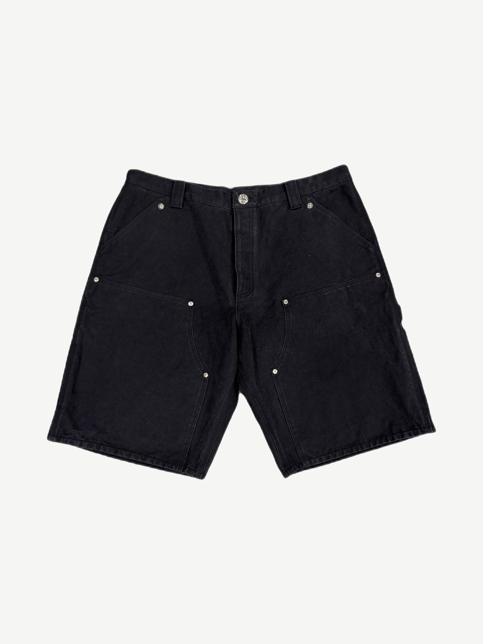 Chrome Hearts black canvas carpenter shorts front view with silver cross button hardware and double-knee panels