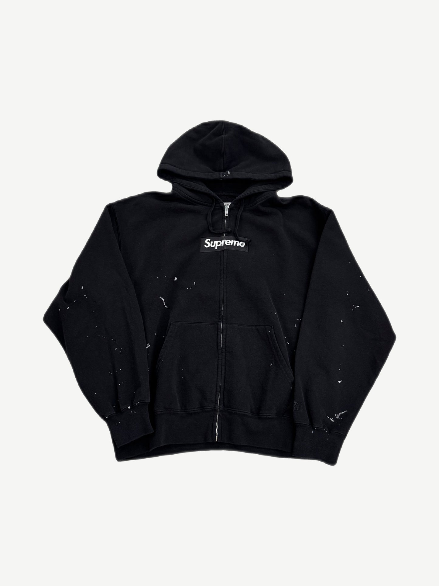 Supreme MM6 Maison Margiela black zip hoodie front view with red box logo on chest panel.